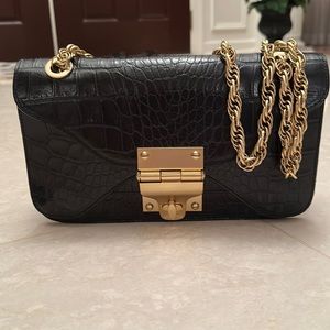 Alexis Hudson gold chain shoulder bag.